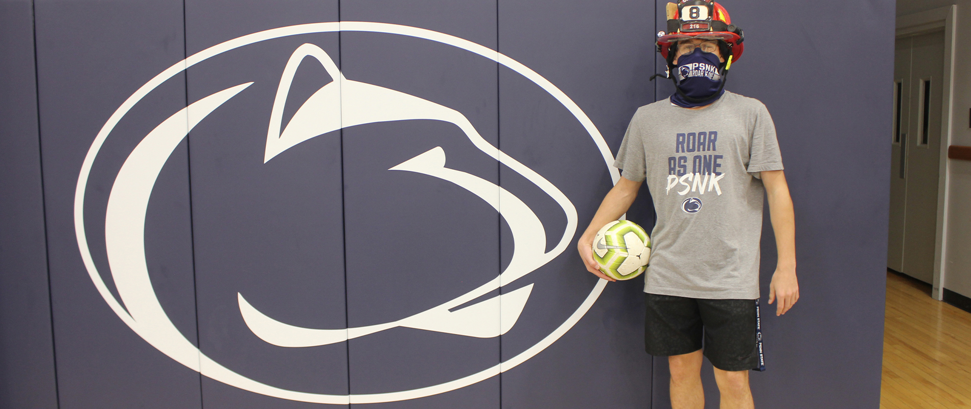 Penn State New Kensington's Joey Flanick poses in his fireman's helmet.